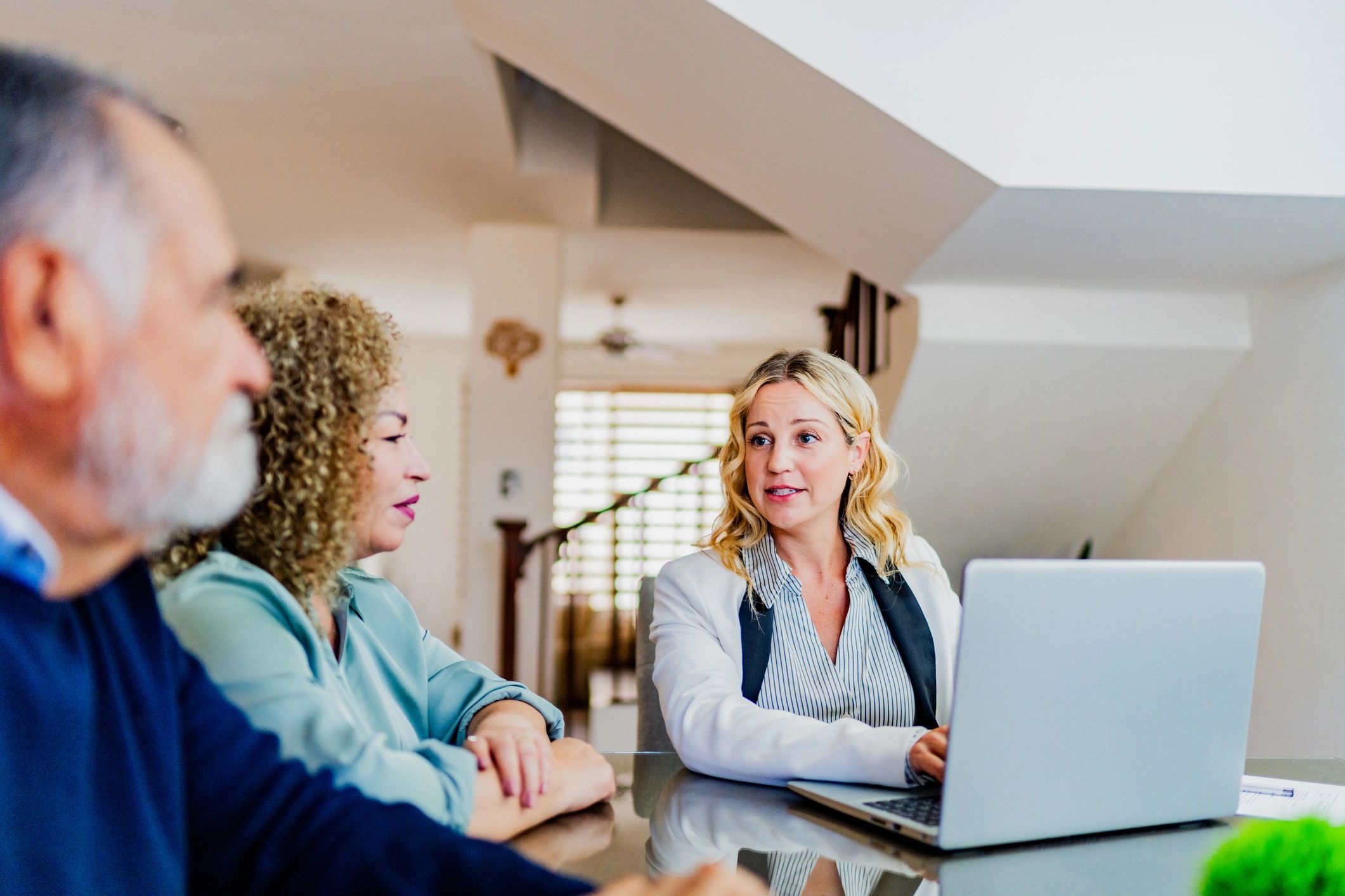 Consultant meeting with clients to discuss requirements