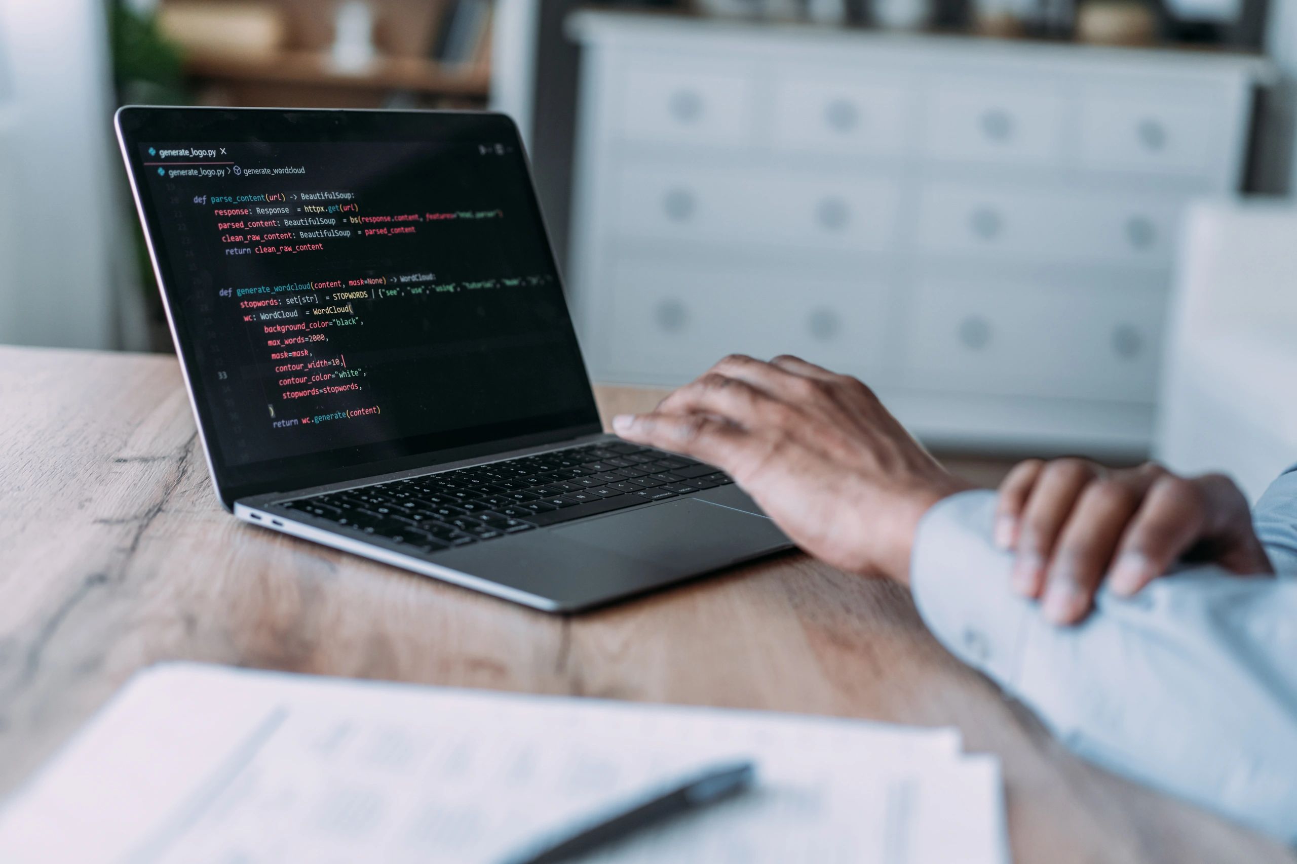 Developer working on automation and integration code on a laptop